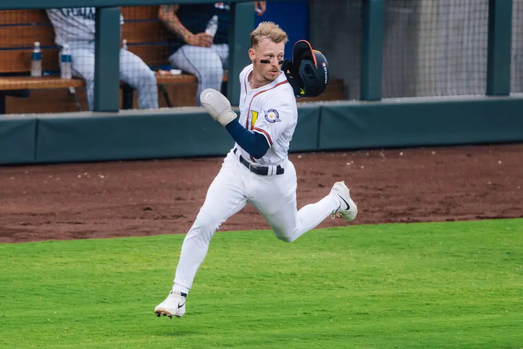 Las Vegas Aviators catcher Cole Conn running toward home plate